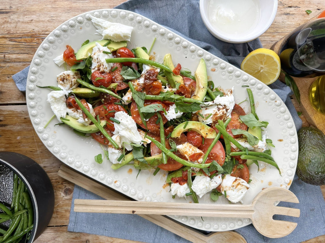 Warm Caprese Salad with a roasted tomato balsamic vinaigrette.