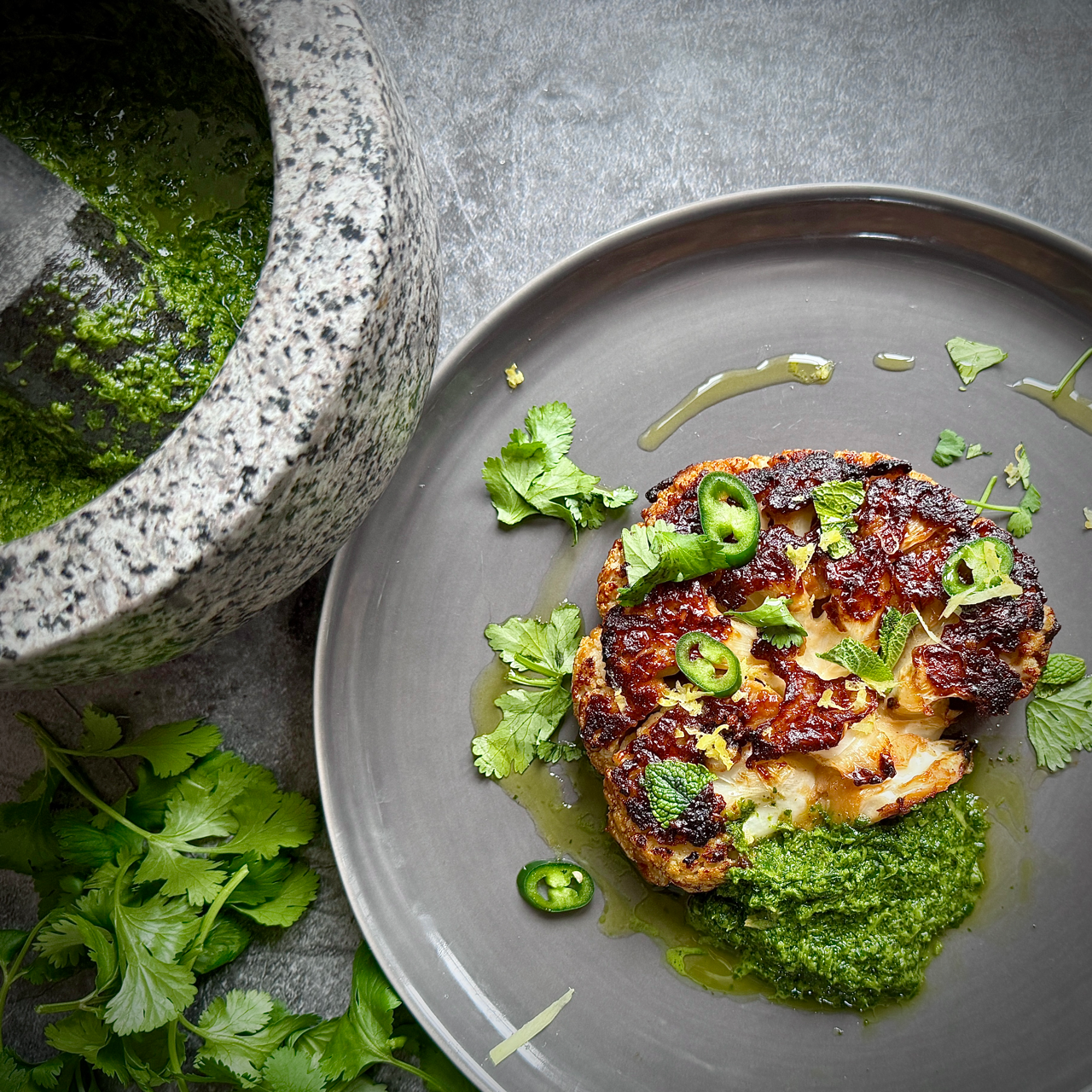 Miso glazed Cauliflower steak with Cilantro, Mint and Chilli salsa verde