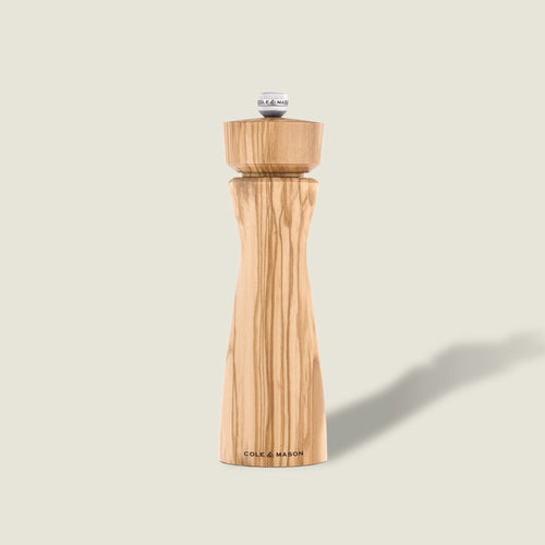 #pepper The Portobello Olive Wood Salt & Pepper Mills by Cole & Mason feature a smooth olive wood finish, adjustable grind, and upright design—an elegant addition to any premium gift box.