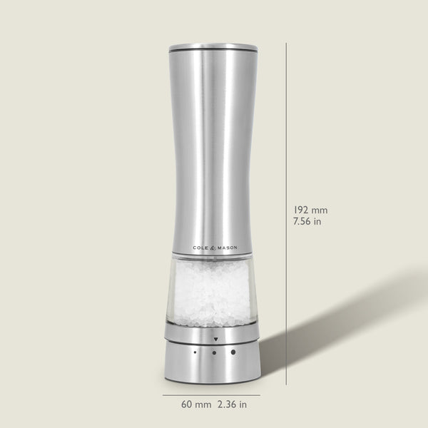Sleek, tall Cole & Mason Electric Derwent Salt Mill in silver, featuring a transparent lower section that displays the salt crystals; measures 7.56 in (192 mm) in height and 2.36 in (60 mm) in width with the Cole & Mason logo on the grinder.