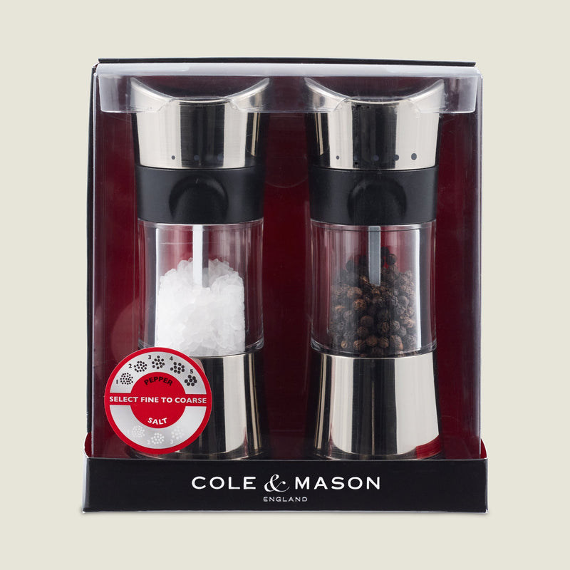 #salt&pepperset
The Cole & Mason Horsham Salt & Pepper Mills boxed set features stainless steel tops, high-performance adjustable grinders, and comes pre-filled with coarse salt and peppercorns in clear packaging with a red and black background.
