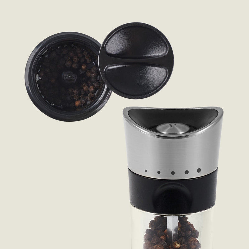 #pepper
The Cole & Mason Horsham Salt & Pepper Mills feature stainless steel and glass construction, a black plastic top, an open lid showing whole peppercorns, and adjustable settings for customized grinding.