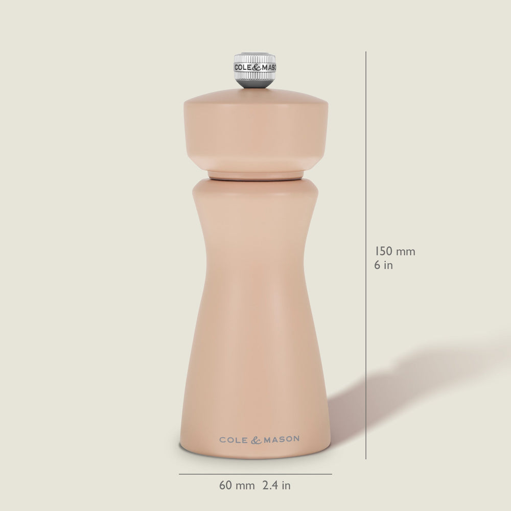 A Cole & Mason Kenton Salt & Pepper Mill in Himalayan Salt, featuring a modern, curved design with a metal knob on top and a durable ceramic grinding mechanism, is set against a plain, light background.
