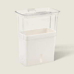 The Cole & Mason UK Burwell Self Watering Potted Herb Keeper Small and Tealby Herb Keeper are transparent rectangular containers with white bases and clear lids, ideal for storing and self-watering herbs using absorbent pads to keep them fresh.